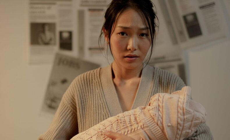 pregnant holding her tummy