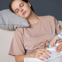 pregnant holding her tummy